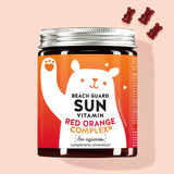 Una lata de Beach Guard Sun Vitamins with Red Orange Complex de Bears with Benefits para la piel dañada por el sol.